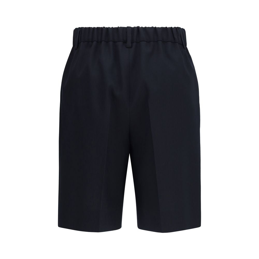 Shorts bermuda en coton noir de Gucci, style décontracté avec logo Gucci visible, parfait pour un look casual et élégant.