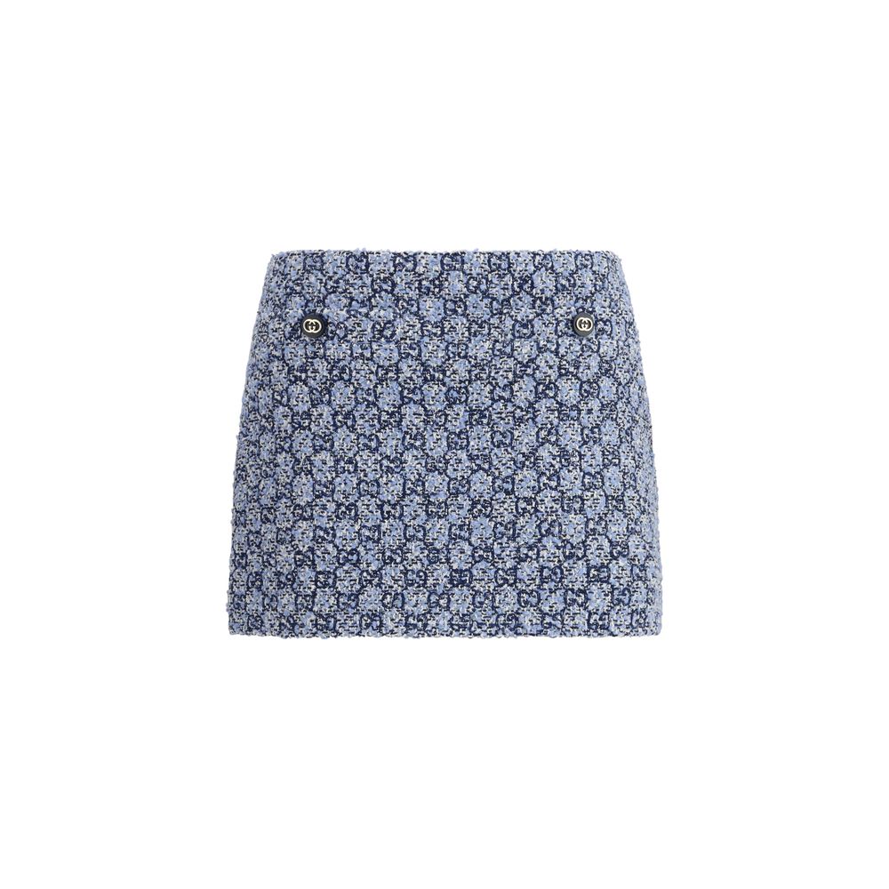 Jupe courte en coton bleue de Gucci, style mini, avec détails élégants, portée par un mannequin.