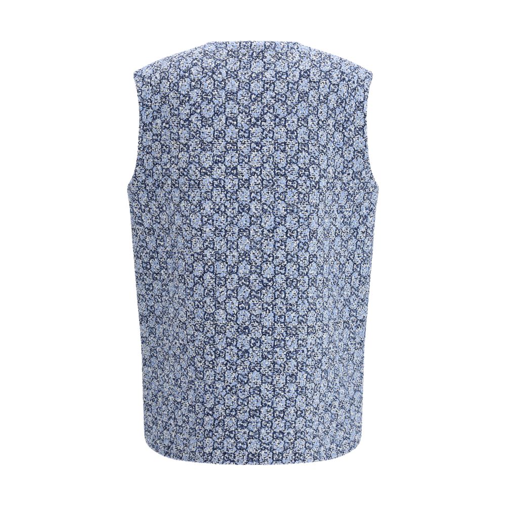 Veste sans manches en coton bleu de Gucci, style élégant, visible avec détails de la marque Gucci sur le devant.