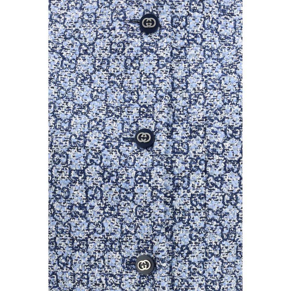 Veste sans manches en coton bleu de Gucci, style décontracté, avec logo Gucci visible sur le devant.