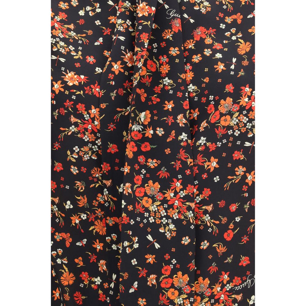 Chemise en soie multicolore Gucci avec motif élégant, manches longues et col classique, tissu luxueux et design sophistiqué.