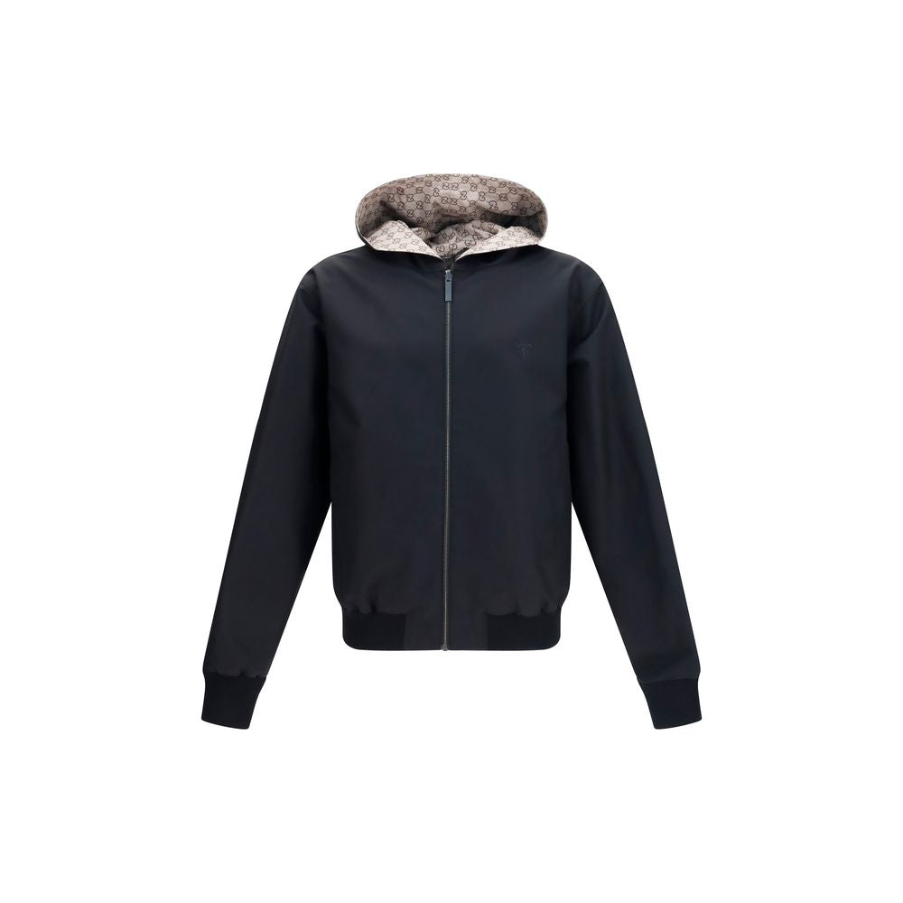 Veste en polyester noire de Gucci, veste élégante avec logo Gucci visible, pour un style moderne et sophistiqué.