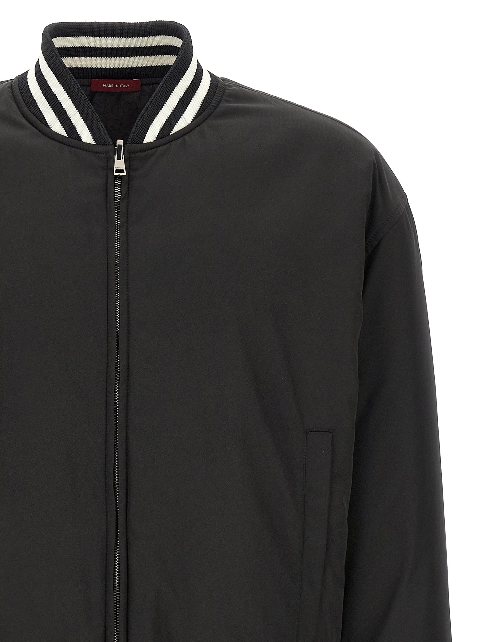 Veste bomber bicolore en polyester Gucci avec fermeture éclair et col côtelé, vue de face.