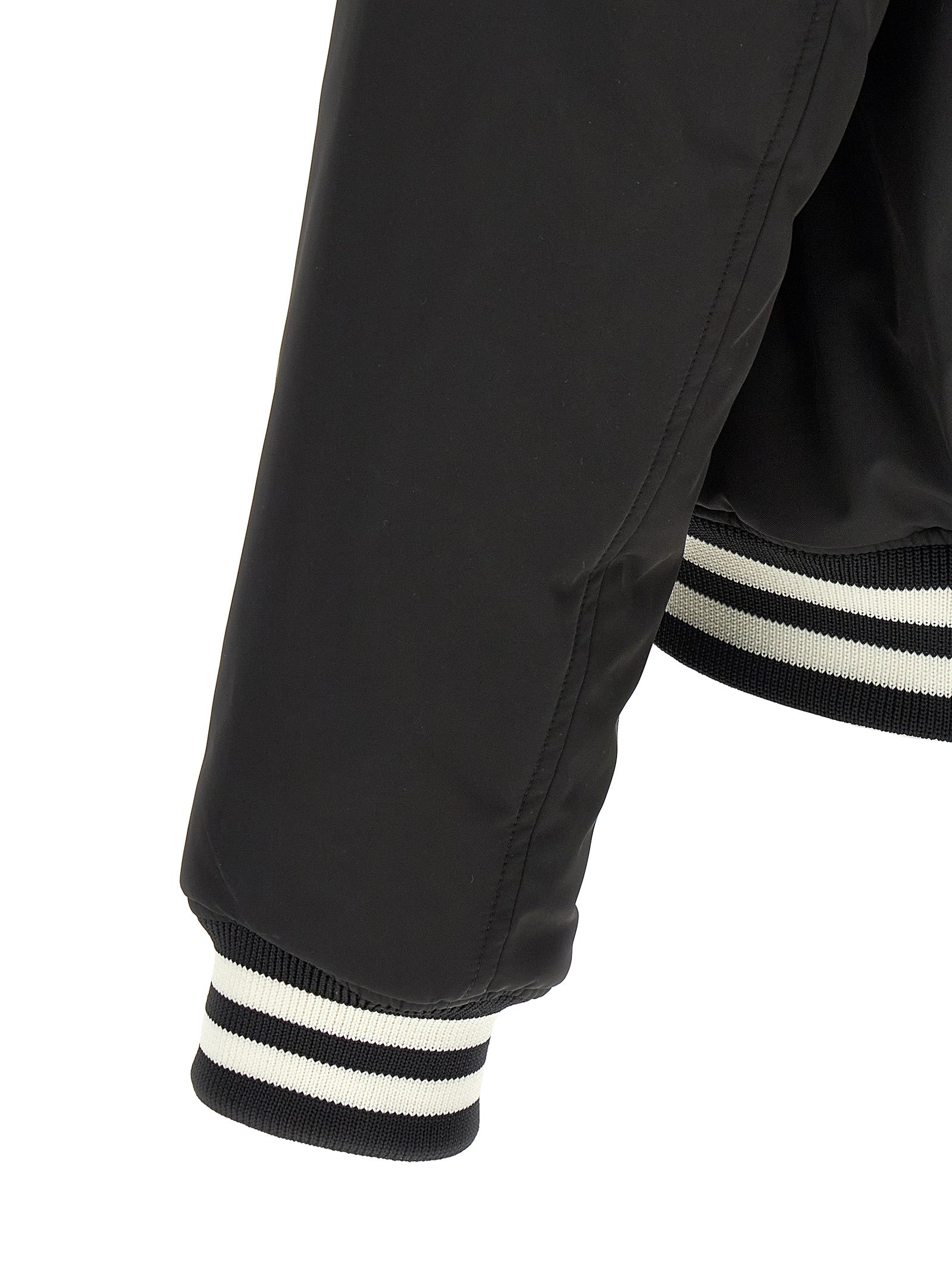 Veste bomber bicolore en polyester Gucci avec logo Gucci visible sur le devant, style moderne et élégant.