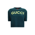 Sweat-shirt en laine bicolore Gucci, style décontracté avec logo Gucci visible, porté sur un mannequin.