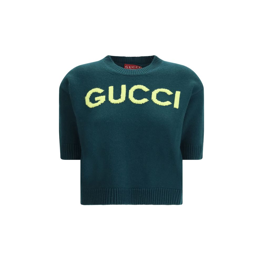Sweat-shirt en laine bicolore Gucci, style décontracté avec logo Gucci visible, porté sur un mannequin.