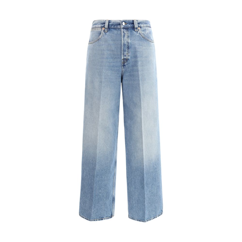 Jeans en denim coton bleu clair de Gucci, coupe classique, visible avec détails de couture et logo de la marque.