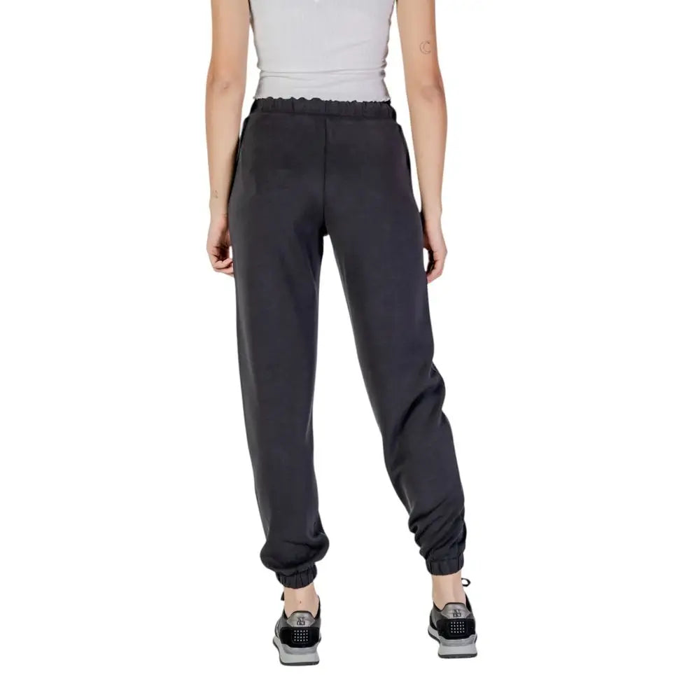 Pantalon de jogging noir guess active en polyester avec taille élastique froufroutée et poignets resserrés