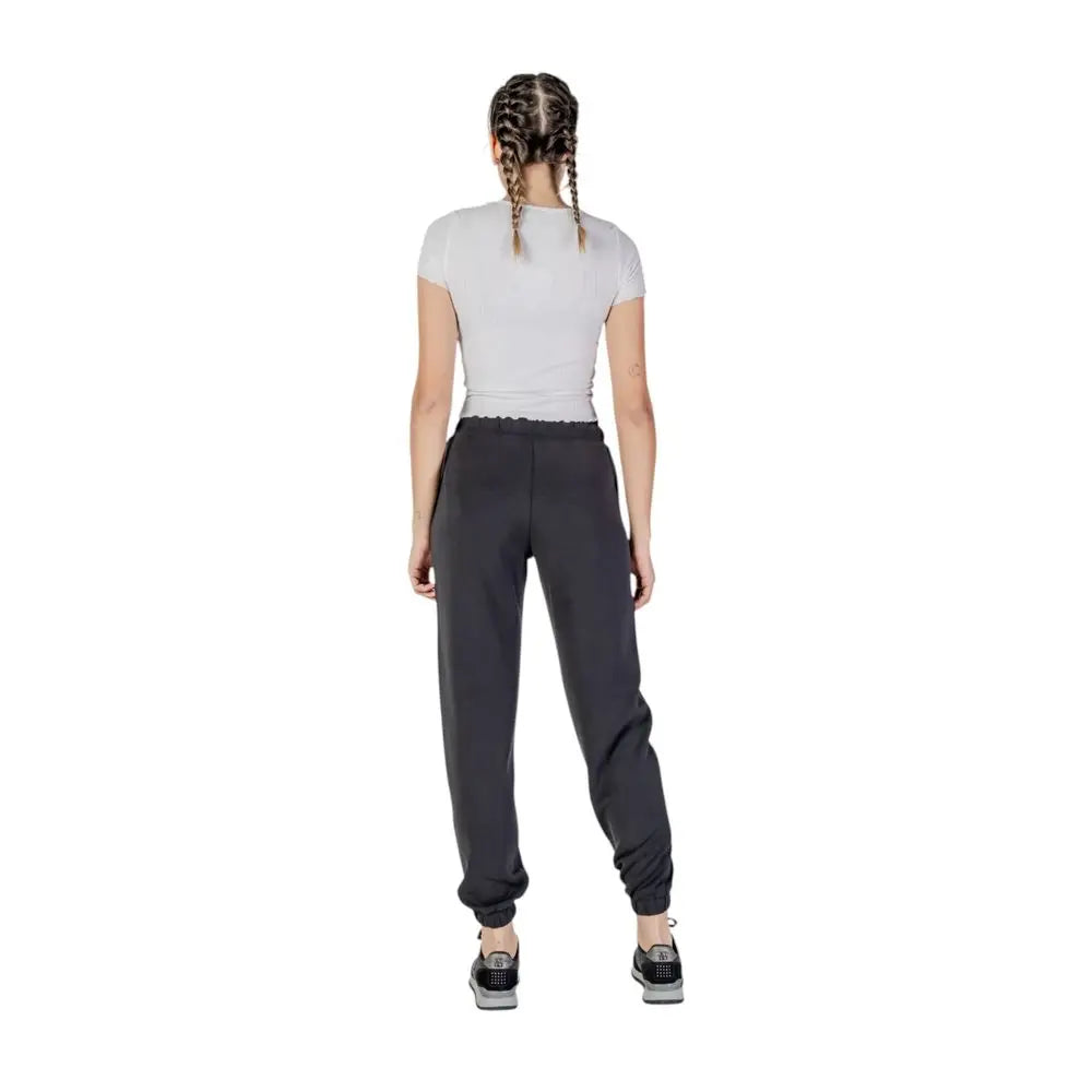 Pantalon de jogging guess active noir en polyester avec taille élastique et chevilles resserrées pour le sport