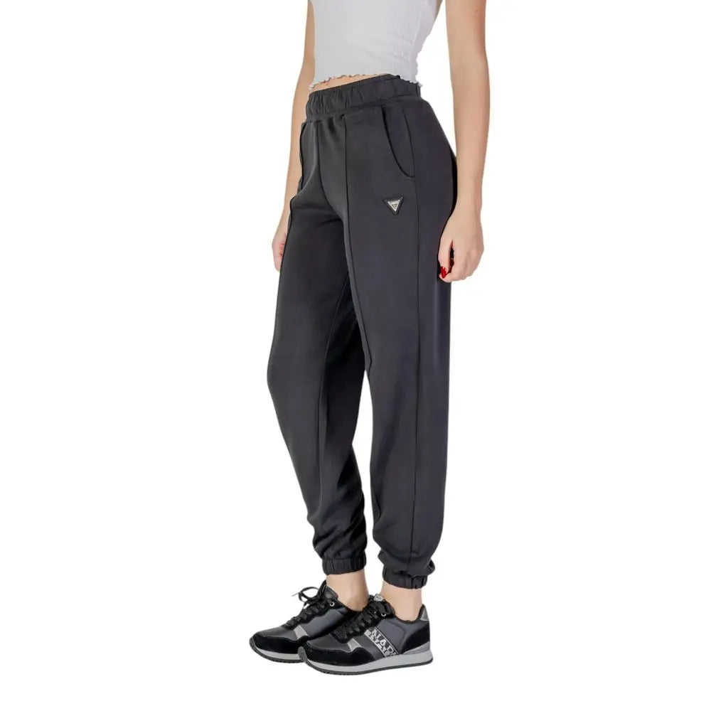 Jogging noir guess active en polyester avec taille à cordon, poignets élastiques et logo triangulaire sur la cuisse
