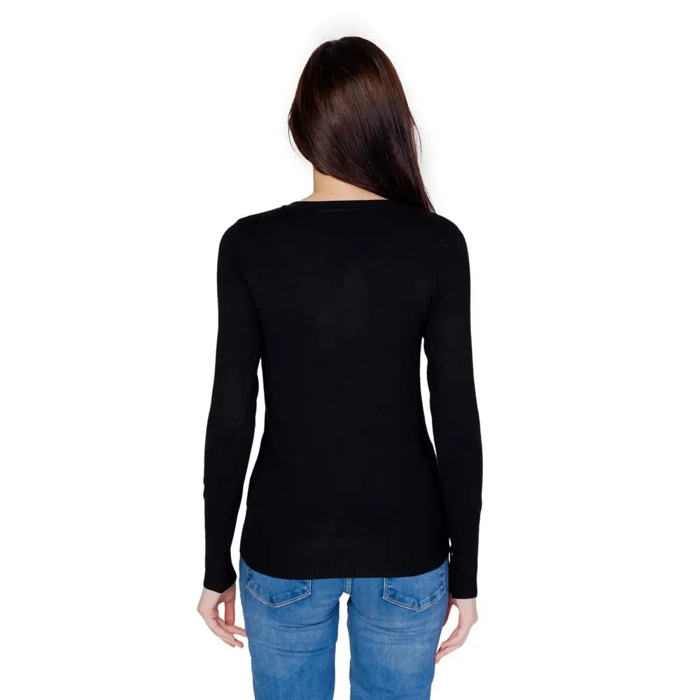 Pull noir guess en coton avec manches longues col rond simple et coupe ajustée