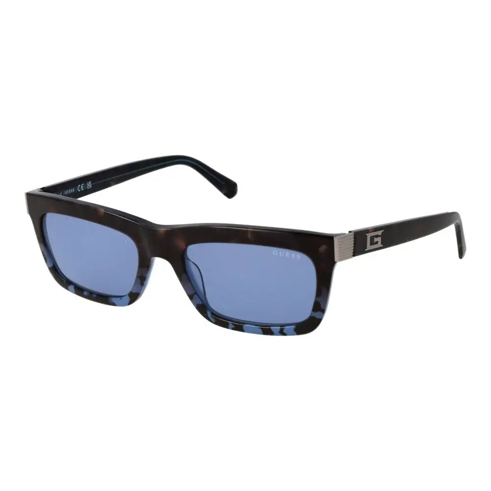 Lunettes de soleil guess en acétate bleu avec monture rectangulaire motif écaille et logo argenté sur la branche