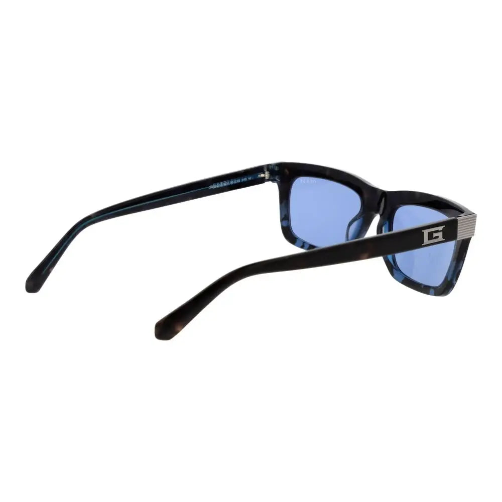 Lunettes de soleil guess blue en acétate noir écaille avec verres bleus et logo argenté sur la branche