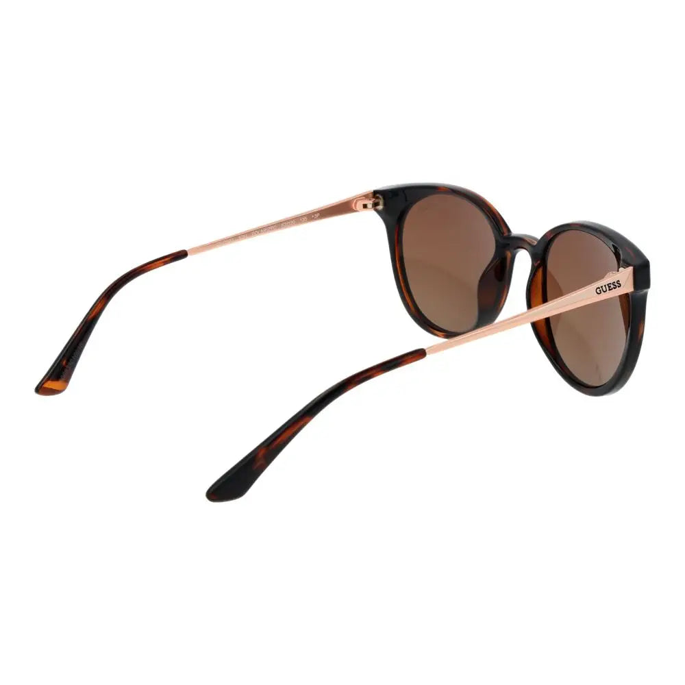 Lunettes de soleil guess marron en acétate avec monture ronde, branches métal rose doré et verres dégradés brun