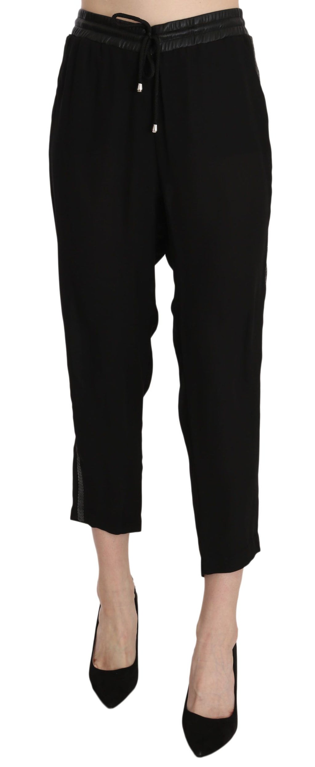Pantalons cropped noirs Guess en polyester à taille haute, vue détaillée du devant sur fond blanc.