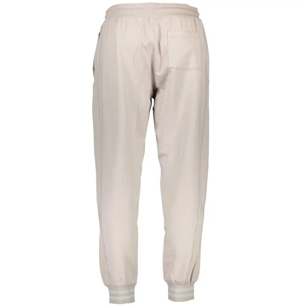 Beige cotton guess jeans men’s trackpants with relaxed fit elastic waistband and ribbed cuffs