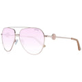 Lunettes de soleil aviator guess en métal rose gold avec verres dégradés roses et emblème circulaire sur la branche
