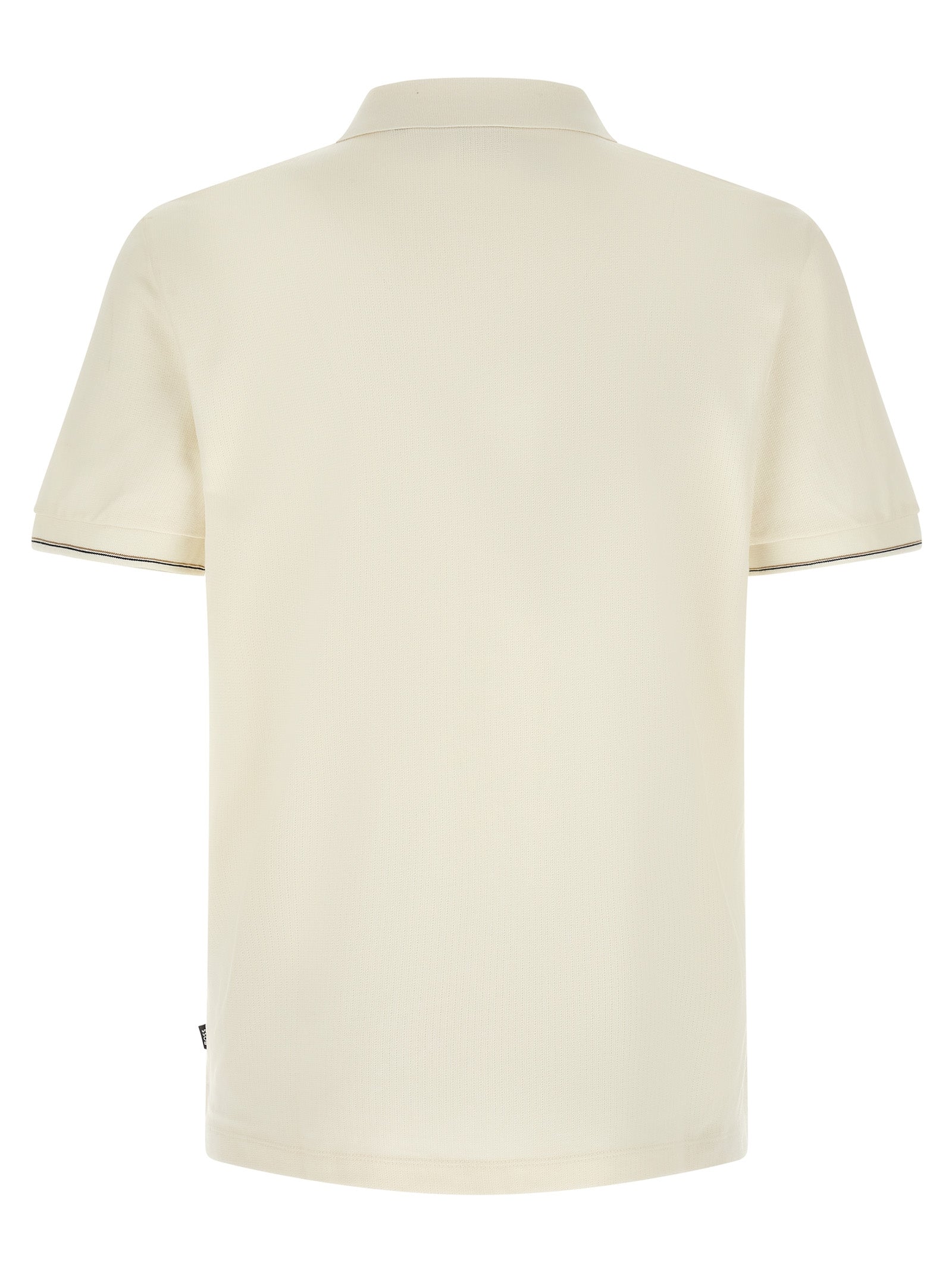 Chemise polo beige en coton de la marque Hugo Boss, avec col et boutons visibles, idéale pour un style décontracté élégant.