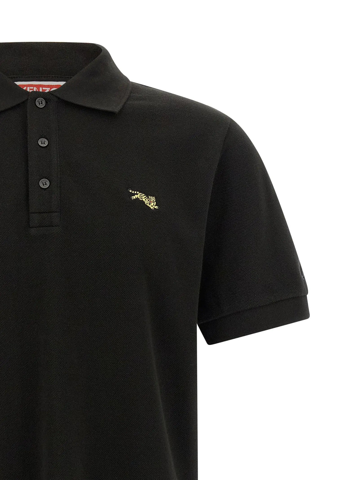Polo en coton noir kenzo avec logo tigre brodé en or sur la poitrine