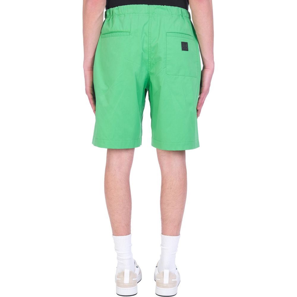 Jupe mi-longue en coton bicolore de Kenzo, longueur au genou, avec un design moderne et élégant.