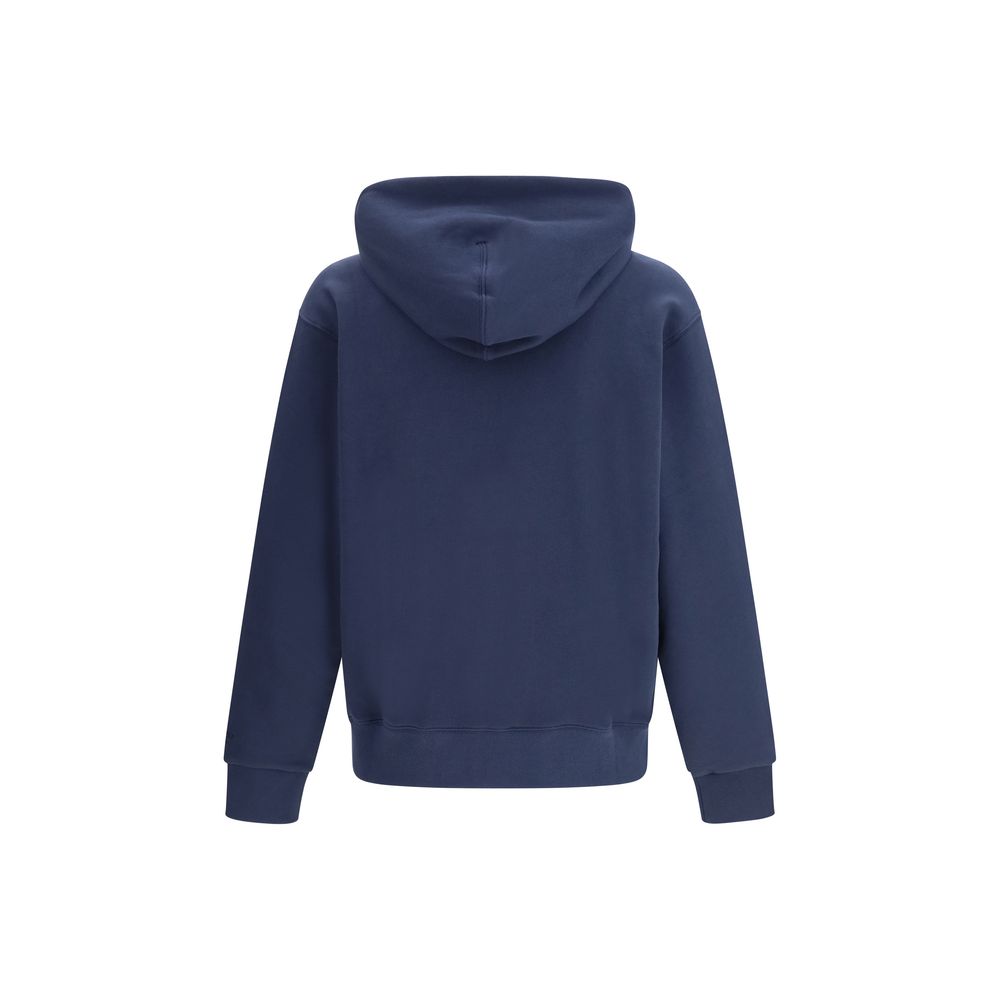 Sweat-shirt en coton bleu Kenzo avec logo brodé, porté par un mannequin sur fond neutre, mode décontractée élégante.