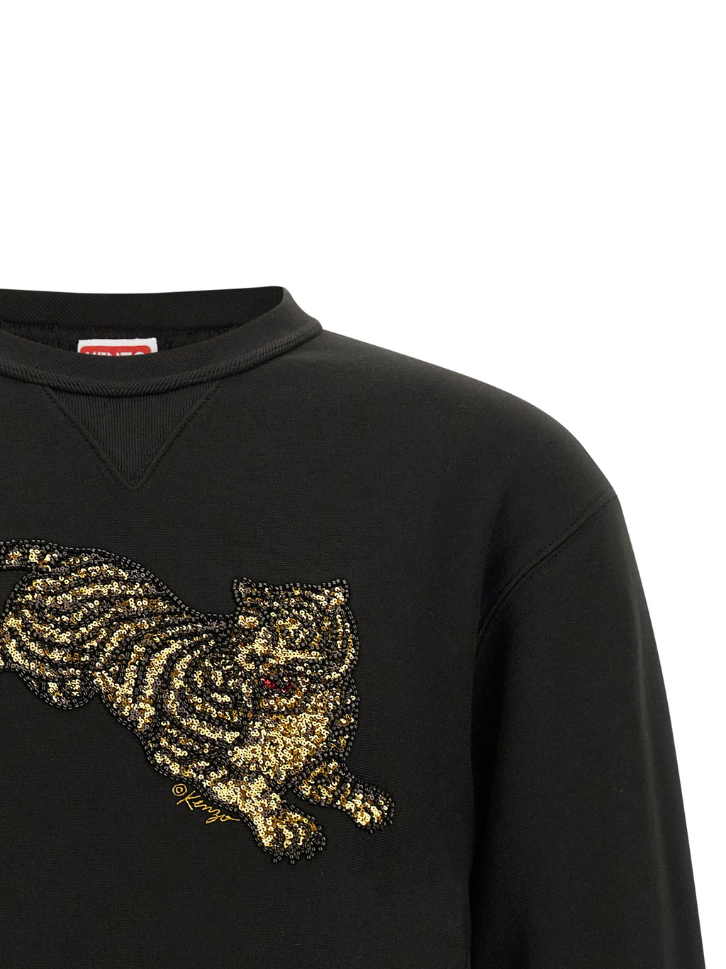 Sweat-shirt en coton noir de la marque Kenzo, coupe décontractée et logo Kenzo visible sur la poitrine.