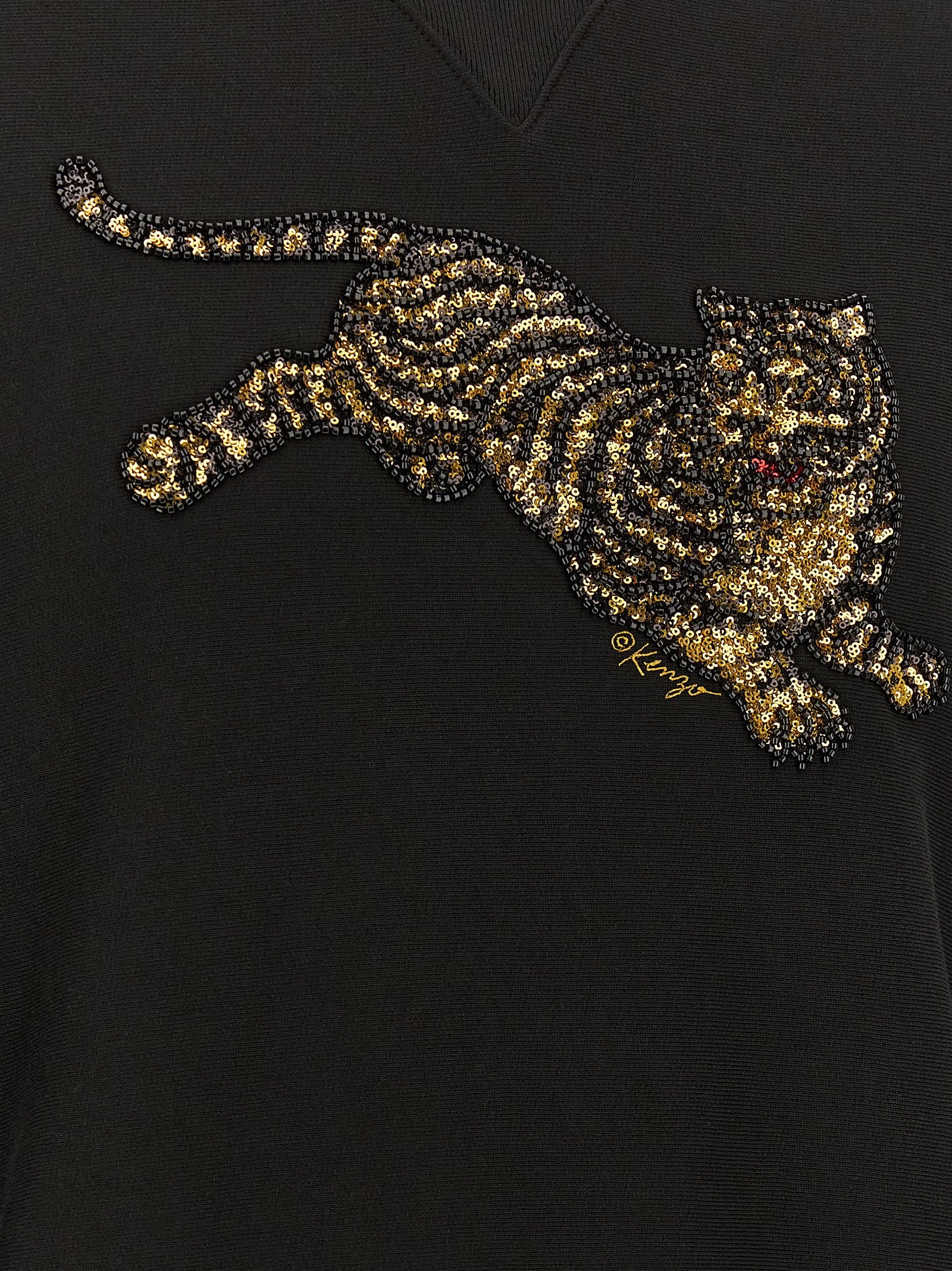 Sweatshirt en coton noir de la marque Kenzo, vue de face, avec logo discret sur la poitrine, pour homme ou femme.