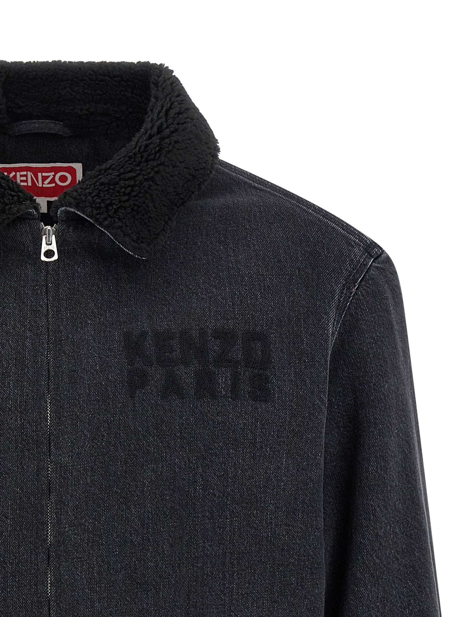 Veste en jean noire en coton de la marque Kenzo, coupe classique avec détails de couture visibles.