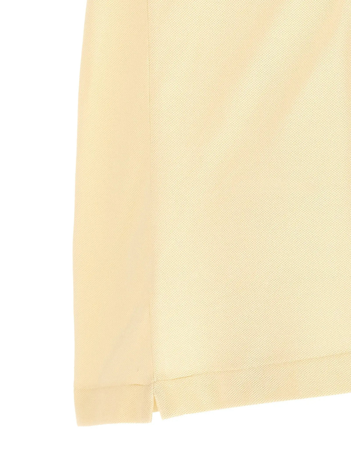 Polo lacoste bicolor en coton beige avec tissage texturé subtil et ourlet cousu avec soin