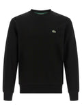 Sweatshirt lacoste noir en coton avec col rond et petit logo crocodile vert sur la poitrine gauche