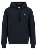 Sweatshirt en coton bleu lacoste avec capuche noire, logo crocodile vert et cordons assortis