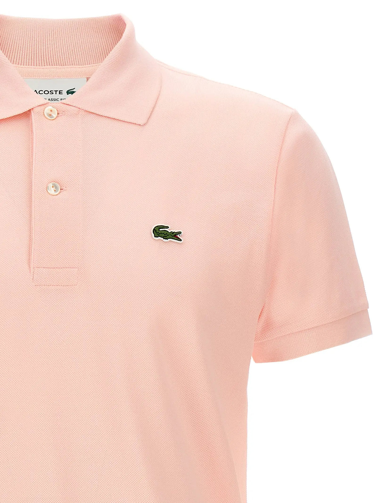 Polo lacoste multicolore en coton rose doux avec texture piquée classique et logo crocodile vert brodé sur la poitrine