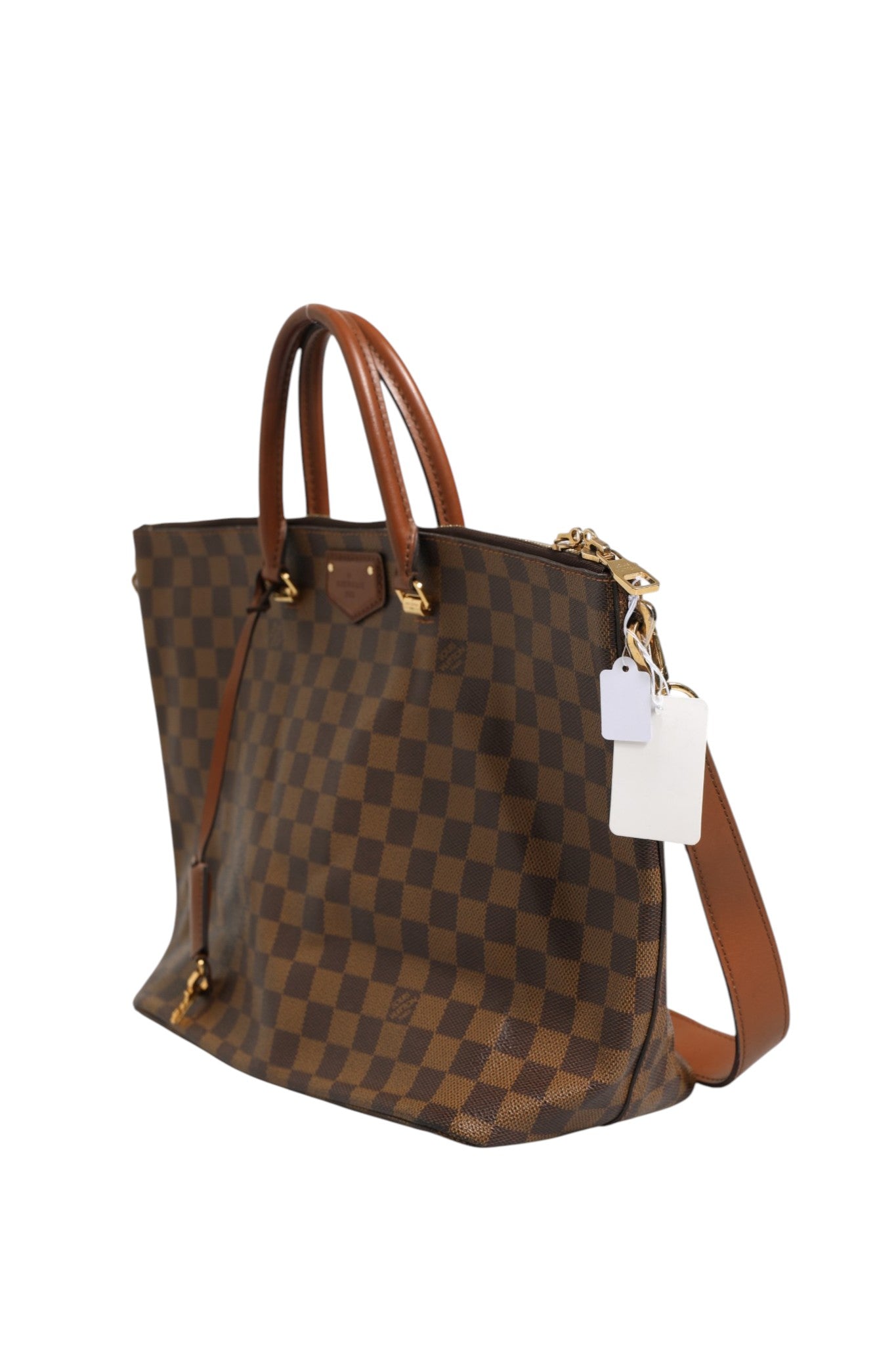 Sac tote Louis Vuitton Damier Ebene Belmont en toile à motif damier, avec poignées en cuir et logo Louis Vuitton visible.