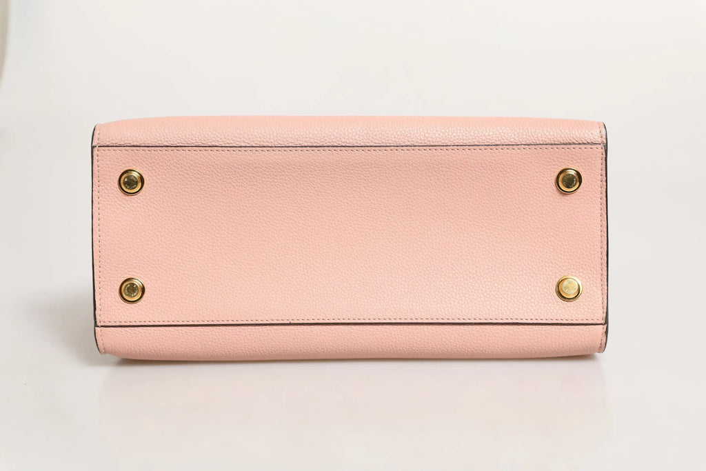 Sac à main louis vuitton city steamer en cuir rose et noir avec ferrures dorées en cuir souple