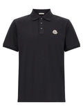 Polo moncler bleu en coton avec col classique et logo brodé sur la poitrine au tissu texturé subtil