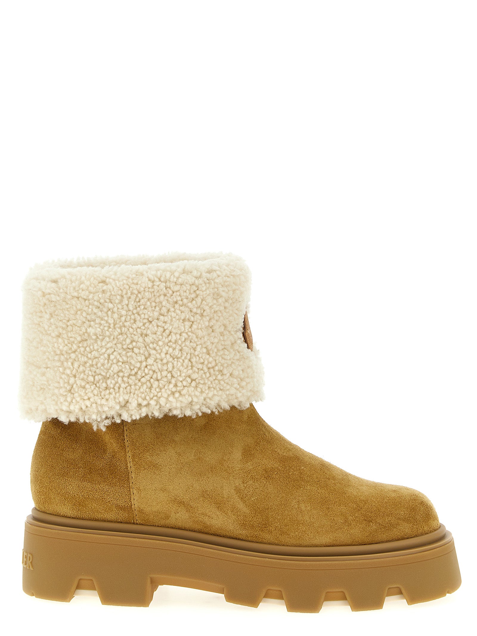Bottes d ankle en cuir de veau beige de Moncler pour femme, avec semelle antidérapante et design élégant.