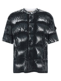 T-shirt en coton noir de la marque MONCLER GENIUS, coupe classique avec logo visible sur le devant.