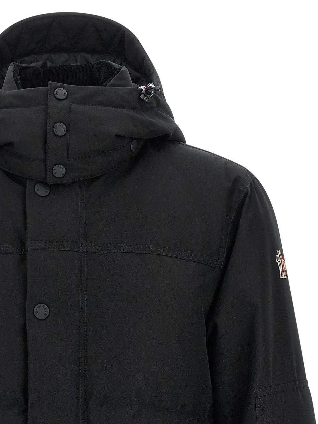 Veste moncler grenoble noire en polyester avec capuche, fermeture boutonnée et logo discret sur la manche