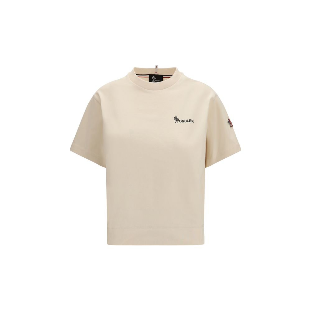Vêtements de sport en coton beige Moncler Grenoble, style décontracté et confortable pour activités sportives ou casual.