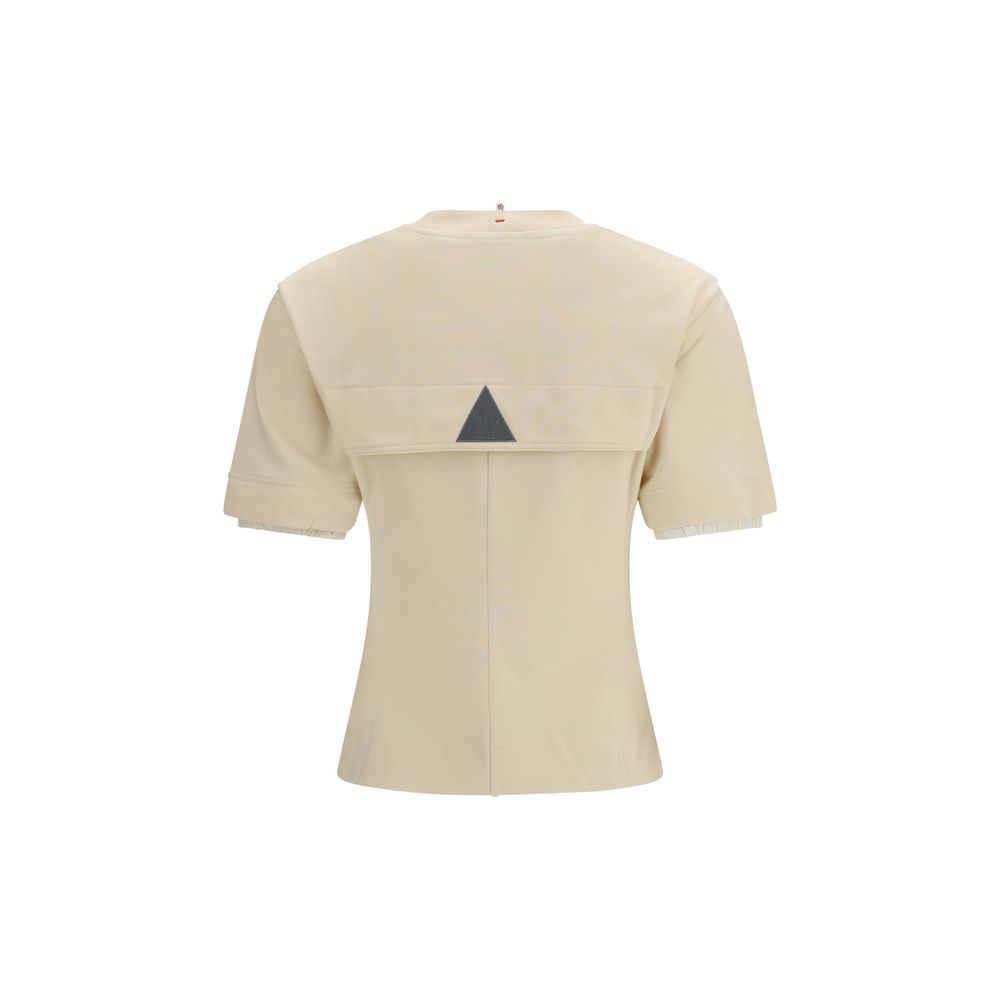 T-shirt beige en coton Moncler Grenoble, coupe classique, visible sur un mannequin avec col rond et manches courtes.