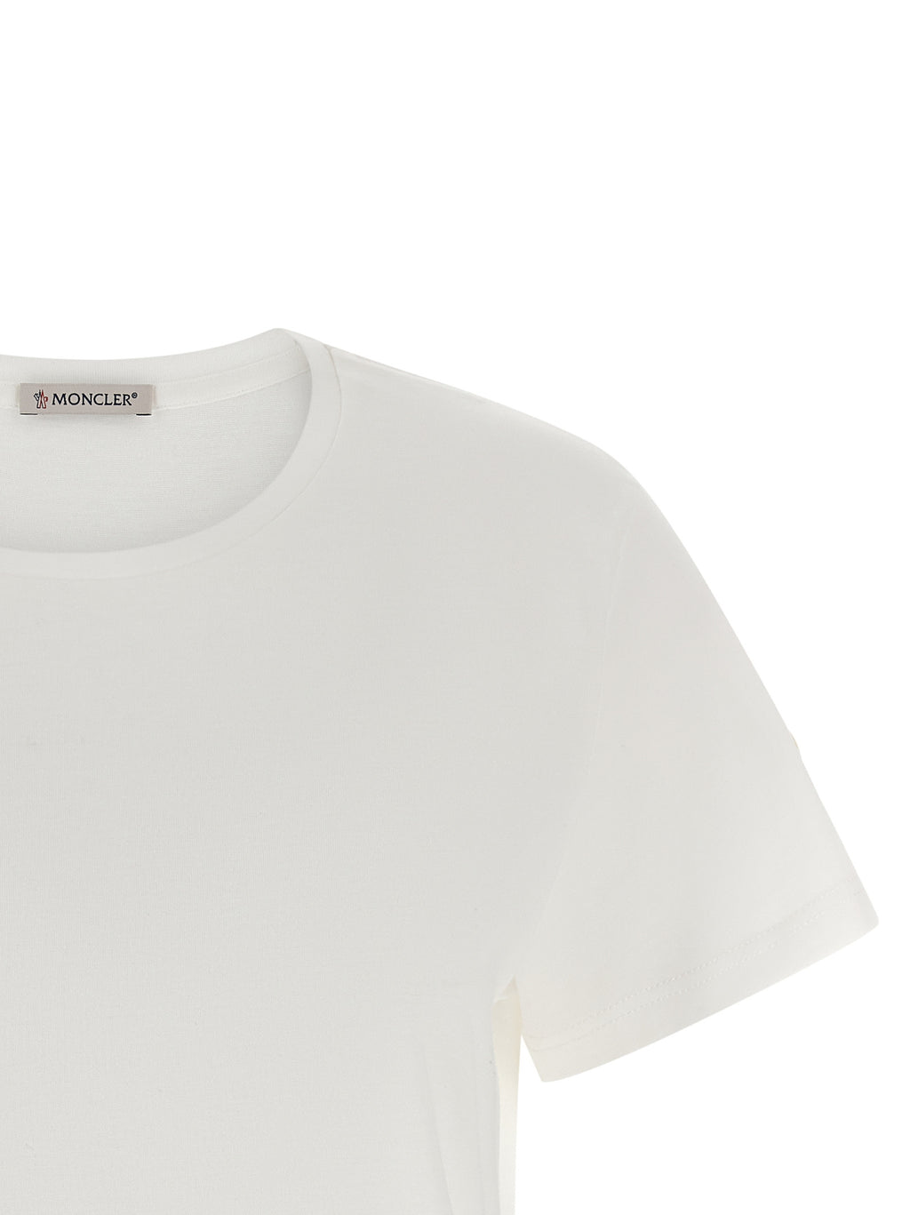 T-shirt blanc en coton de la marque Moncler, vue de face, avec logo discret sur la poitrine.