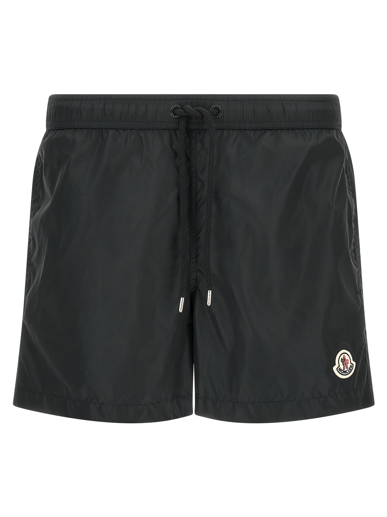 Pantalon noir en polyamide de longueur knee de la marque Moncler, visible avec une coupe élégante et tissu léger.
