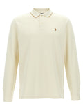 Chemise polo Ralph Lauren beige en coton, vue de face, avec col et boutons visibles, tissu doux et élégance classique.