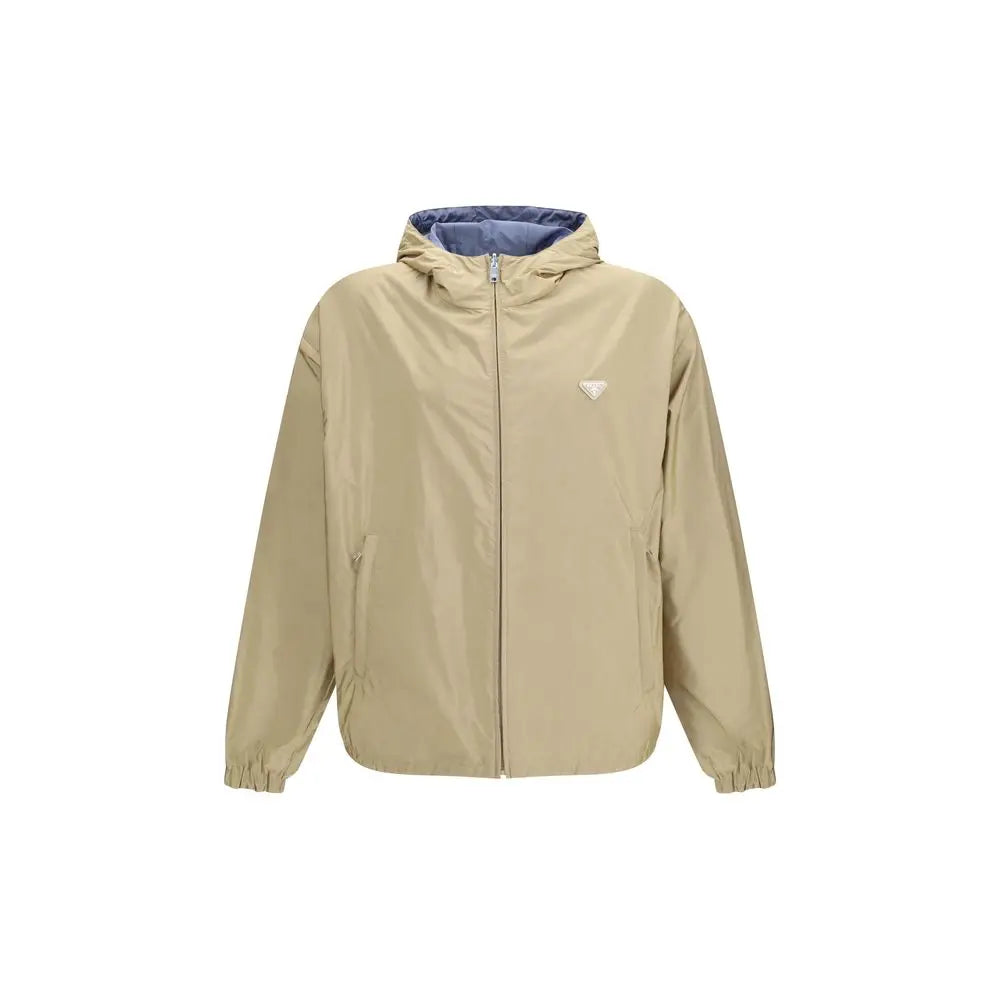 Beige prada hooded jacket in recycled polyamide shell with blue interior lining and subtle triangular logo on chest