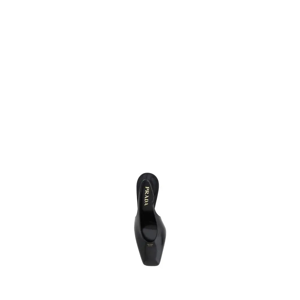 Prada black calf leather pumps with sleek glossy finish and pointed toe in black