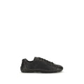 Baskets basses Prada black lamb ovis aries en cuir noir avec design minimaliste et détails subtils cousus