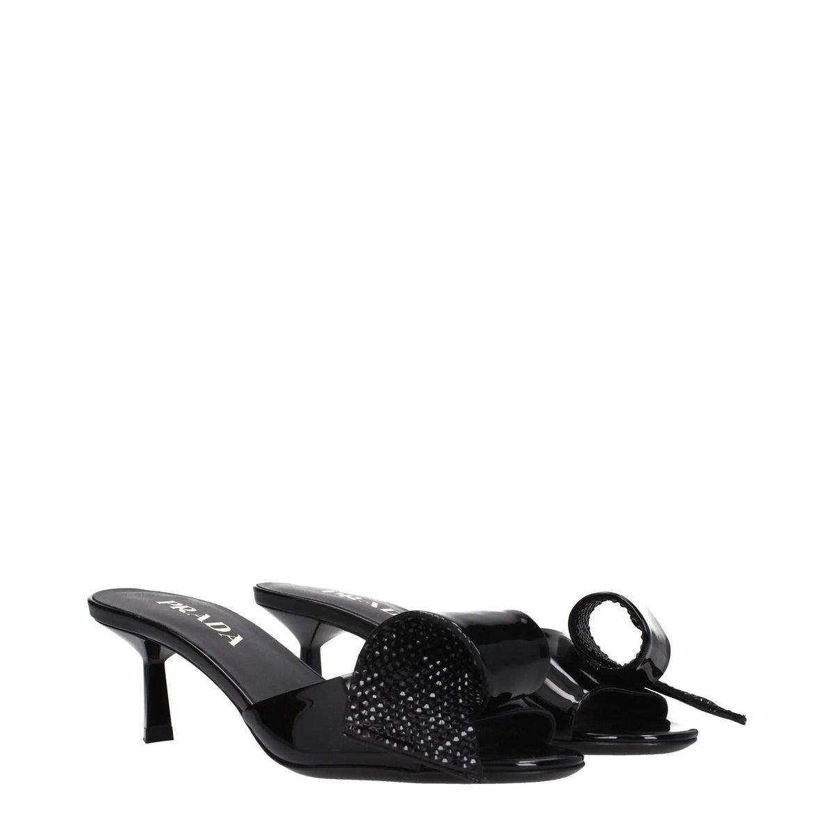 Mules prada noires en cuir avec fini brillant et détail de nœud scintillant