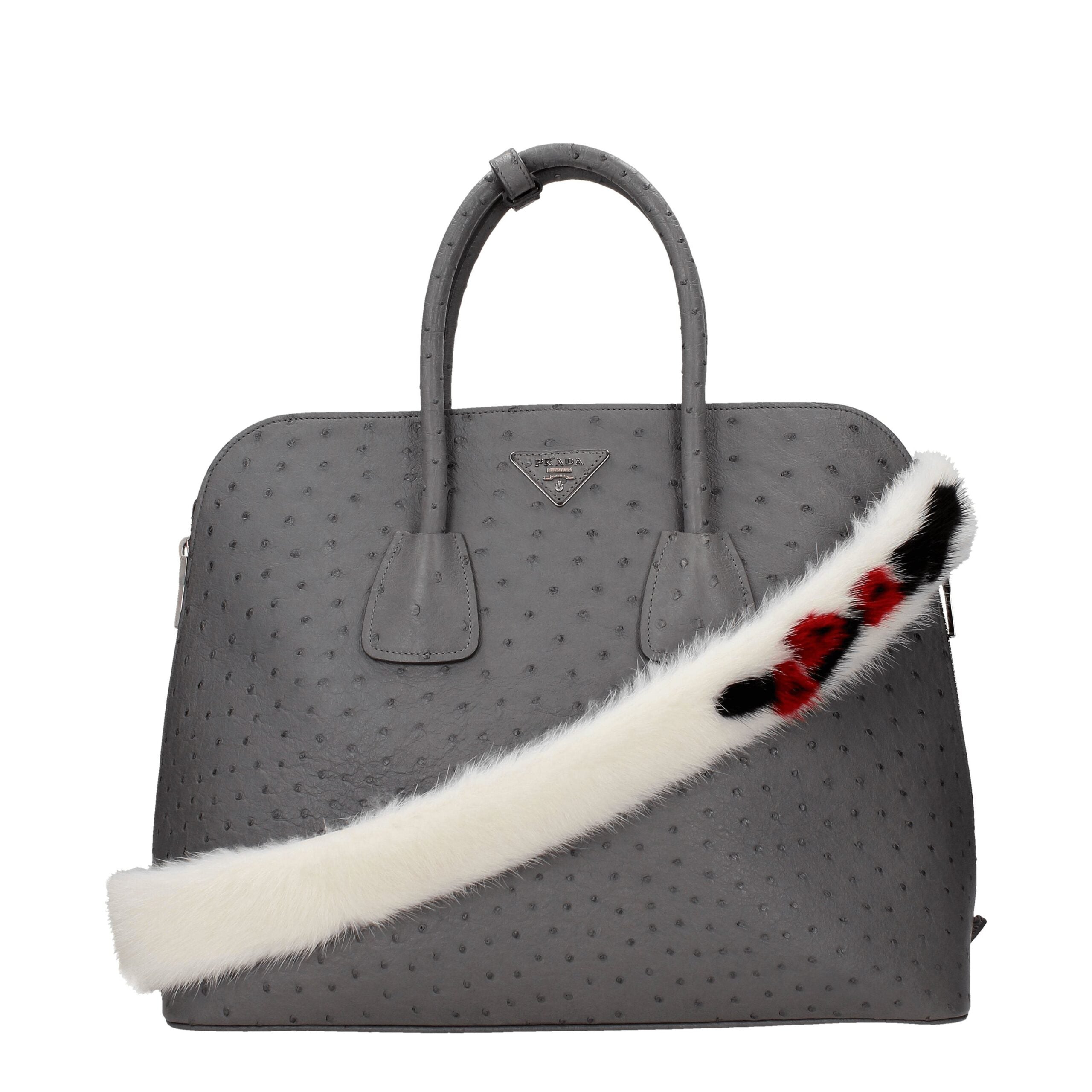Sac à bandoulière en cuir blanc Prada, élégant et sophistiqué, avec détails en cuir de qualité visible sur l'image.