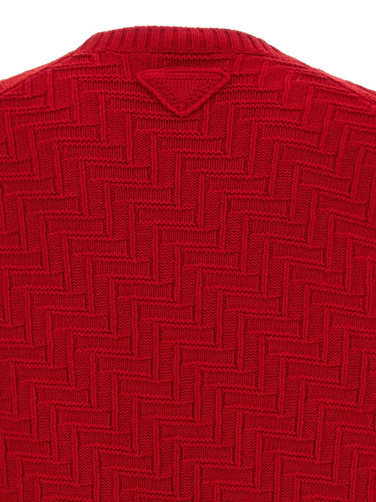 Cardigan prada multicolore en laine vierge avec motif chevrons rouge et logo triangulaire au niveau du col