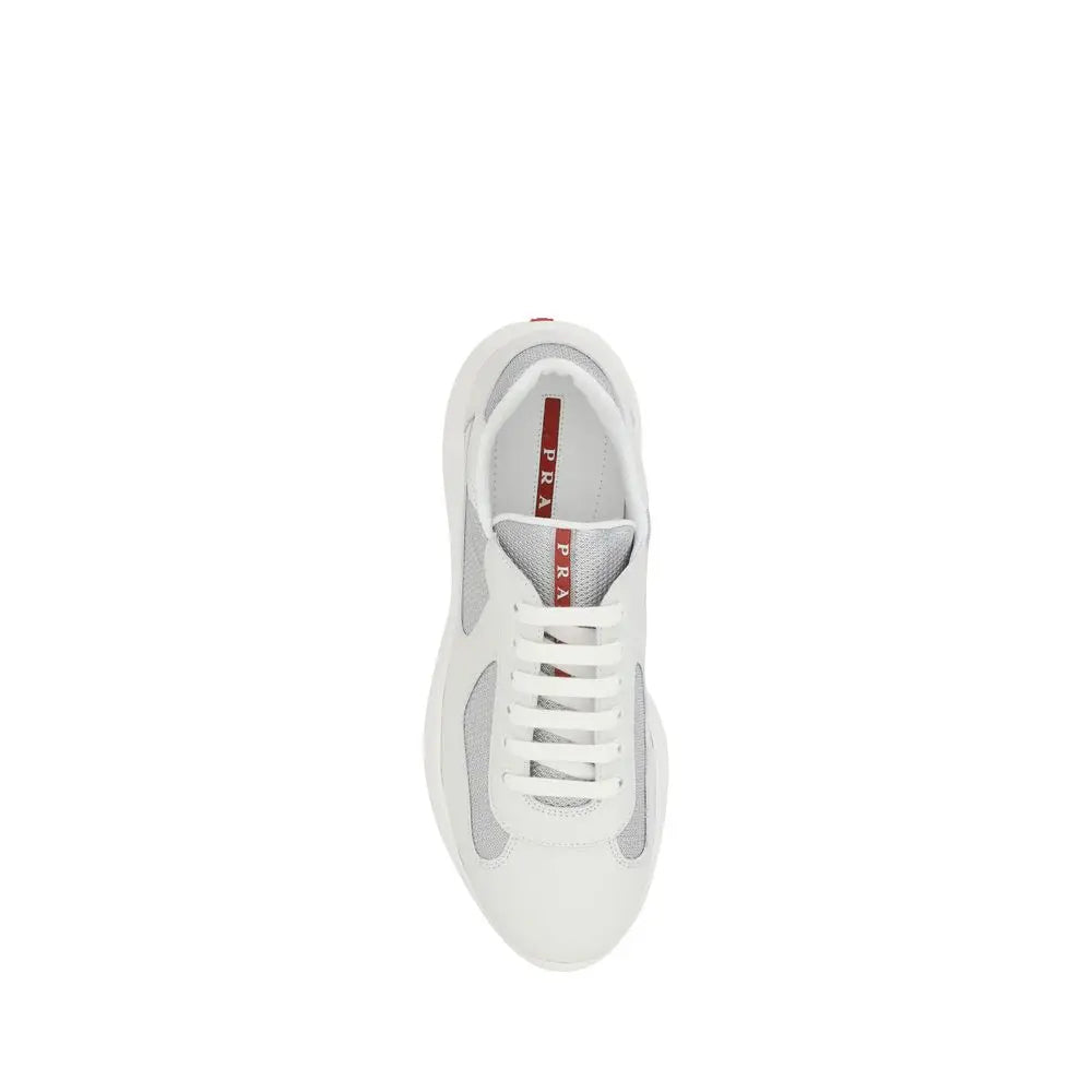 Prada white polyamide low top sneakers with gray mesh panels and red branding on the tongue